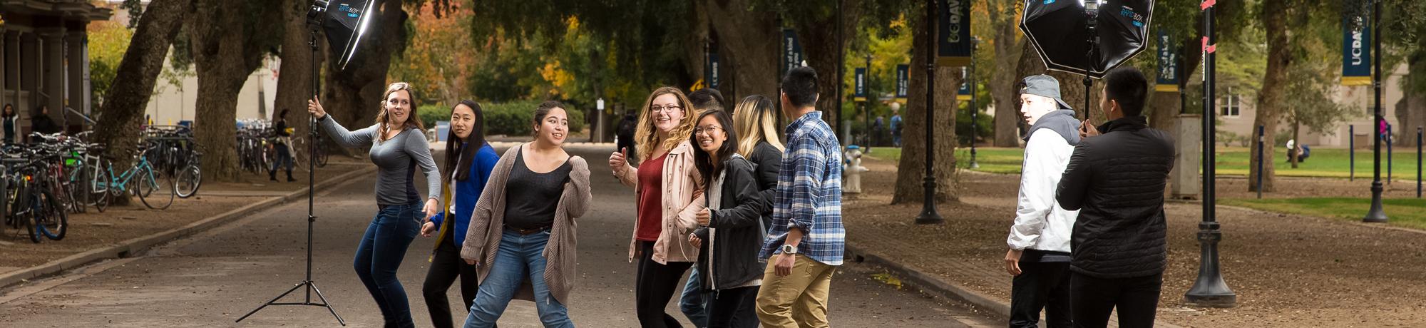 students setting up for a photo shoot