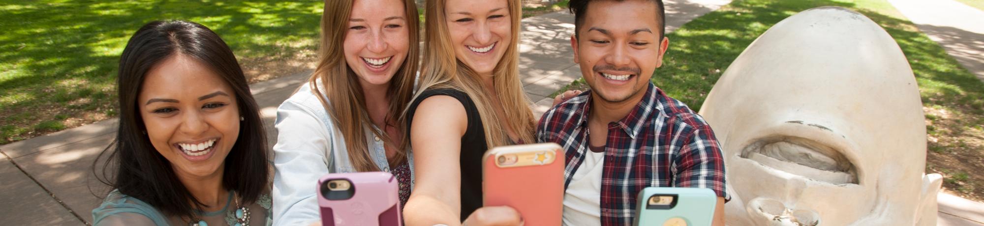 Students taking selfies